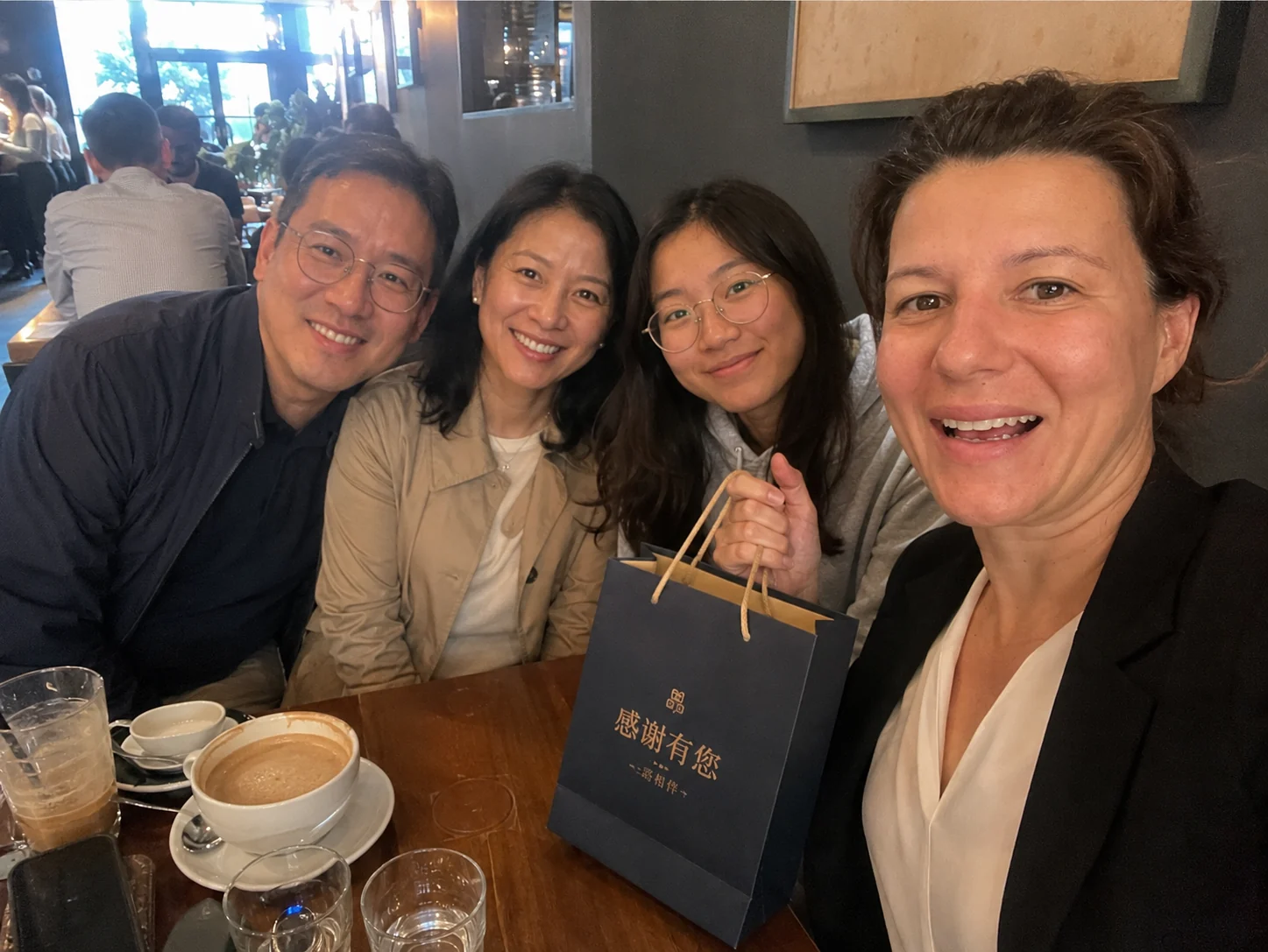 Chinese student Wengyi and her family celebrating educational success