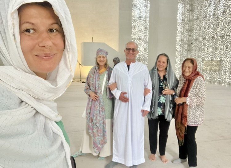 Silvia with a family during a cultural tour in Abu Dhabi