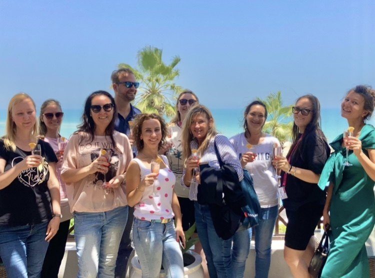 Silvia with guests at a luxury resort setting