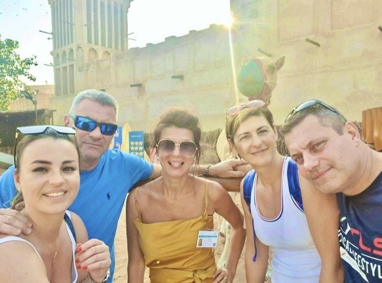 Silvia smiling with guests on a boat